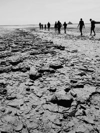 People walking on beach