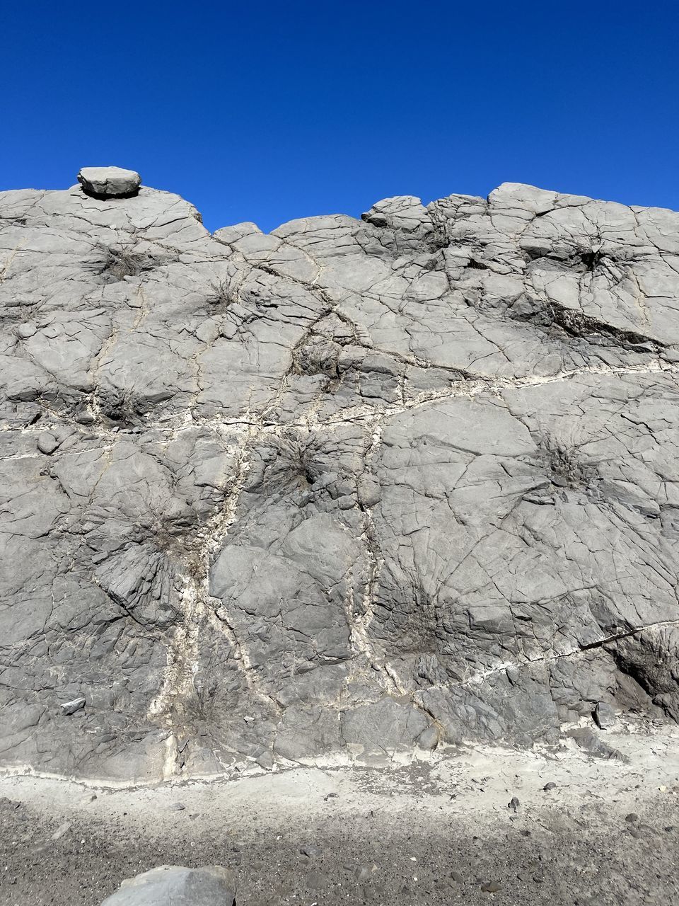 nature, no people, rock, day, outdoors, blue, close-up, textured, sky, architecture, clear sky, wall, low angle view, sunlight, wall - building feature, built structure, ancient history, pattern, geology, rough