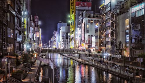 Reflection of illuminated buildings in canal at night