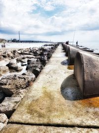 Panoramic view of beach by sea against sky