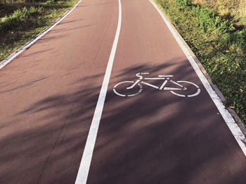 High angle view of bicycle sign on road