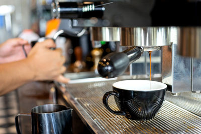 Close-up of coffee cup on table at cafe