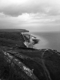 Scenic view of sea against cloudy sky