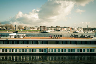 High angle view of river by buildings against sky