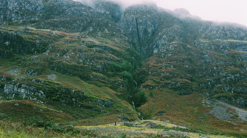 Scenic view of tree mountains against sky