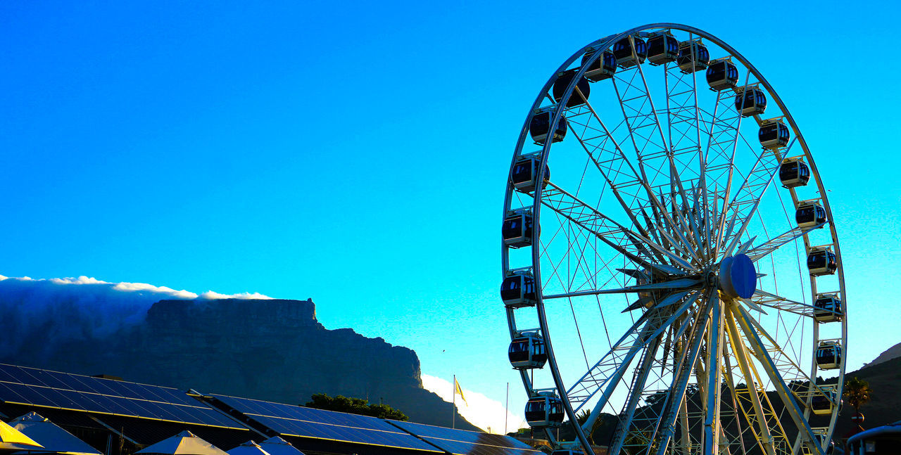 LOW ANGLE VIEW OF FERRIS WHEEL AGAINST CLEAR SKY