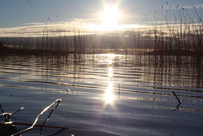 Scenic view of lake against sky during sunset