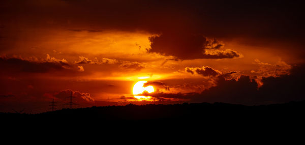 Scenic view of dramatic sky during sunset