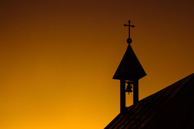 Low angle view of church against clear sky during sunset