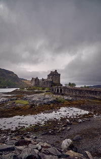 View of old building against cloudy sky