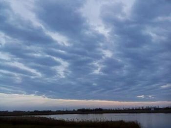 Scenic view of storm clouds over landscape