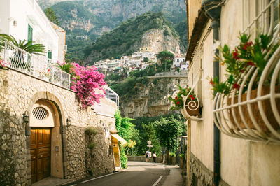 Road amidst buildings at positano