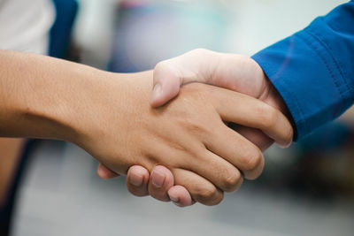 Close-up of man holding hands