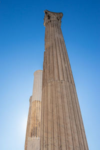 Low angle view of historical building against blue sky