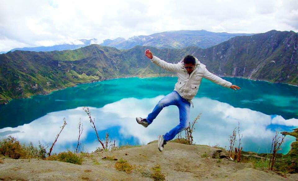 WOMAN JUMPING ON MOUNTAIN