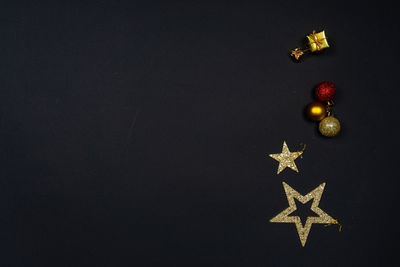 High angle view of fruits against black background