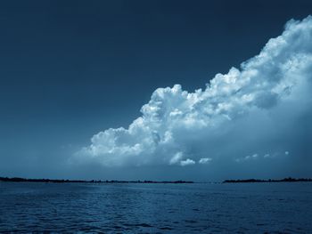 Scenic view of sea against blue sky