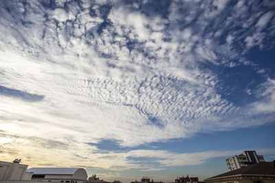 Low angle view of building against cloudy sky