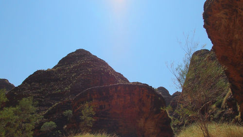 Low angle view of rock formation against clear sky