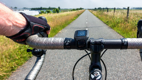Man riding bicycle on road