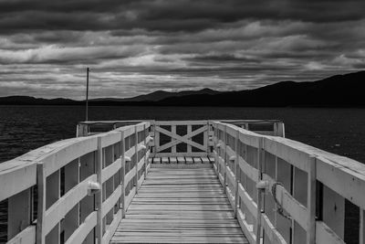 Pier over sea against sky