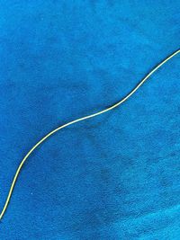 High angle view of cables against blue sky