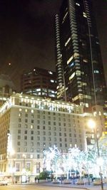 Modern buildings in city at night