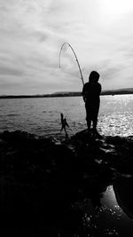 Man fishing in sea