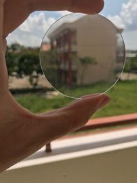 Close-up of hand holding glass