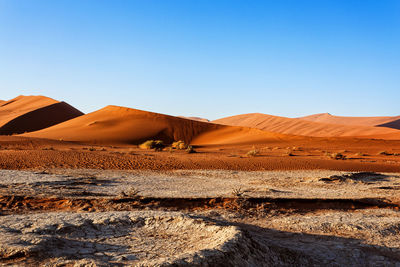 Scenic view of desert against clear sky