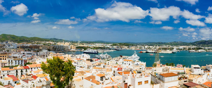 High angle view of town against cloudy sky