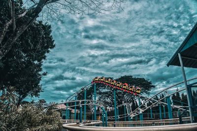 Low angle view of ferris wheel against sky