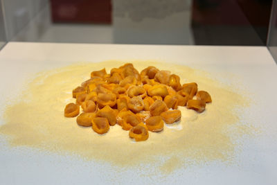 High angle view of candies in plate on table