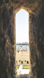 View of sea seen through arch window