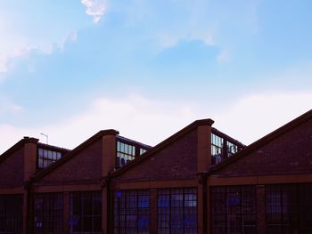 Low angle view of exterior of building against sky