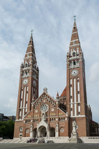 Low angle view of clock tower against sky