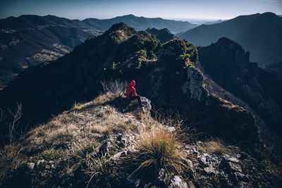 High angle view of man sitting on mountain