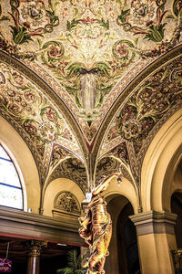 Low angle view of ornate ceiling in historic building