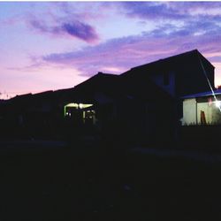 Built structure against sky at sunset