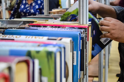 Midsection of woman holding books