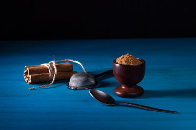 Close-up of ice cream on table against blue background