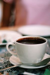 Close-up of coffee cup on table