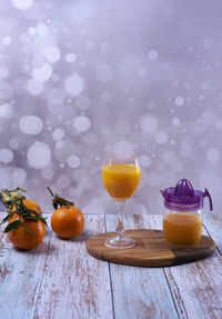 Fruits in glass on table