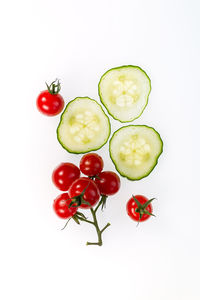 Directly above shot of tomatoes against white background