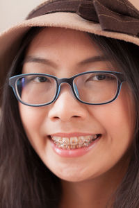 Close-up portrait of smiling young woman