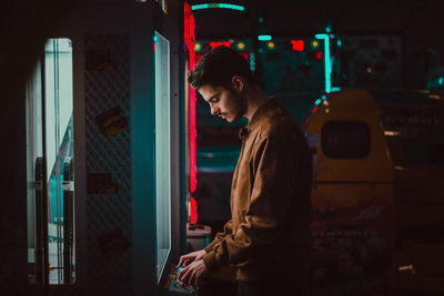 Young man standing in store