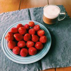 High angle view of strawberries in container on table