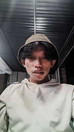 Portrait of young man wearing hat