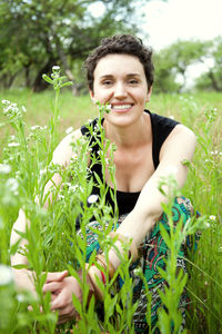 Young cute girl resting on fresh spring grass