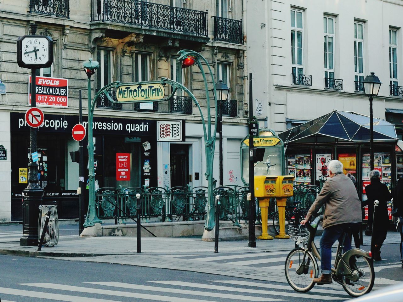 bicycle, city, transportation, architecture, road sign, cycling, full length, outdoors, urban road, day, people, adult, adults only, one man only